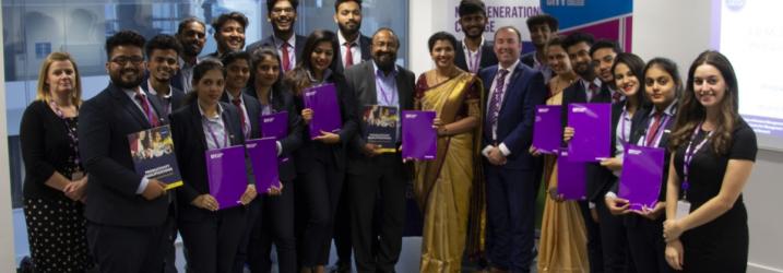 Group of overseas visitors in a classroom at City campus.